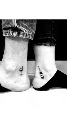 two people with small tattoos on their feet