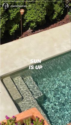 an aerial view of a swimming pool with the words sun is up above it