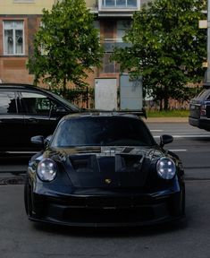 a black sports car parked on the street