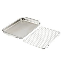 an aluminum baking pan and grid on a white background