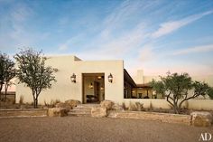 an adobe style home sits in the desert