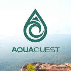 the logo for aquaquest is displayed on top of a mountain with trees in the background