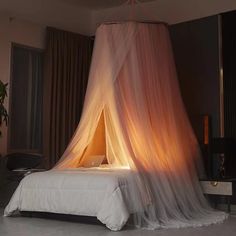 a bed with a white canopy over it