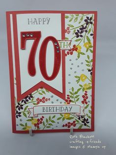 a happy 70th birthday card with a red ribbon on it's corner and the number seventy