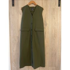 Details Long Oversized Tailored Vest Size Small Green 50% Cotton , 50% Polyester Gap Outerwear For Fall Layering, Sleeveless Khaki Outerwear For Work, Gap Workwear Outerwear With Pockets, Green V-neck Outerwear For Work, Oversized Tailoring, Tunic Vest, Tailored Vest, Global Work, Gap Jacket