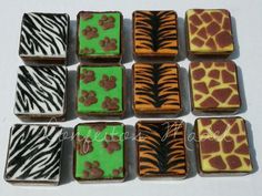 there are many zebra and giraffe cookies on the table