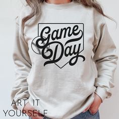 a woman wearing a sweatshirt that says game day