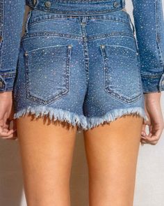 Enhance your wardrobe with these So Dramatic Rhinestone Denim Shorts. The mid rise cut offers a comfortable fit while the all over rhinestone detailing adds a touch of trendiness to your look. The distressed leg opening hem adds a touch of edge to your style. Perfect for any casual occasion. (S) Rise:9.5', Inseam: 3" Model is 5'5" and wearing a size small. Straight Leg Denim Bottoms With Sequins, Straight Leg Denim Sequined Bottoms, Sequined Straight Leg Denim Bottoms, Sequin Denim Bottoms For Spring, Short Denim Party Jeans, Denim Party Shorts, Short Denim Jeans For Party, Short Party Jeans, Rhinestone Denim Jean Shorts For Party