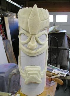 a white mask sitting on top of a wooden table