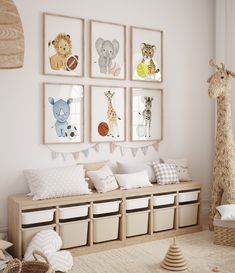 a child's room decorated in neutral tones with pictures on the wall and stuffed animals