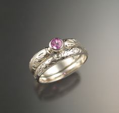 This is an eye clean natural Peppermint Pink Ceylon Sapphire.   4 mm stone weighs about .35ct and is set in 14k White Gold.  The 4mm wide band has a vintage style Victorian floral pattern.  Comes with a matching 2.7mm wide ring band.  Stone is bezel set for ease of wear and superior durability.  Sapphire Hardness is Mohs 9, second only to Diamond.  I can make this ring in any size between 3 and 10.   Specify your size in a "note to seller" at check-out. Wide Diamond Bands, Delicate Gold Ring, Green Tourmaline Ring, Gold Diamond Wedding Band, Diamond Promise Rings, Rose Gold Wedding Bands, Gold Ring Sets, Engagement Ring Set, Bridal Ring Set