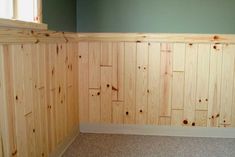 empty room with wood paneling and carpeted floor