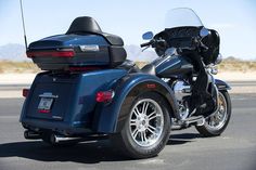 two motorcycles parked side by side on the road