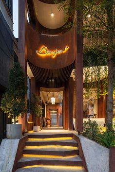 the entrance to an upscale hotel with stairs leading up to it's entry door