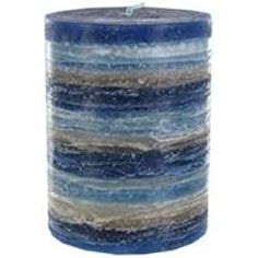 a blue candle with white and brown stripes