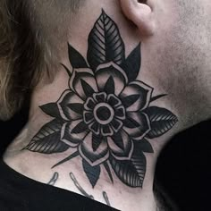 a man with a black and white tattoo on his neck