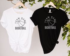 two t - shirts that say team mate and basketball