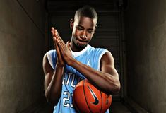 a man holding a basketball in his hands