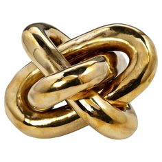 an image of a gold knot ring on a white background