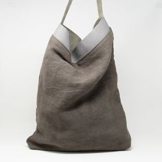 "40% OFF... Linen Tote Bag by C A L M A Project. Beautiful linen and leather full grain tote bag, natural. Very light DETAILS: -This tote bag comes with an internal pocket and leather keychain. -Simple and stylish. DIMENSIONS SIZE M: Height: 13,8\" inches / 35 cm Width: 15,8\" inches / 40 cm Depth: 3,5\" inches / 8 cm Straps: 19\" inches / 48cm 6,3\" /16cm long from top of the bag DIMENSIONS SIZE L: Height: 19,6\" inches / 50 cm Width: 15,54\" inches / 42 cm Depth: 2,76\" inches / 7 cm Straps: 2 Linen Hobo Tote Bag For Daily Use, Linen Tote Shoulder Bag, Modern Canvas Bags With Rolled Handles, Linen Tote Shoulder Bag For Daily Use, Large Capacity Linen Canvas Bag, Everyday Linen Tote Shoulder Bag, Large Capacity Rectangular Linen Canvas Bag, Brown Linen Shoulder Bag For Daily Use, Linen Tote Canvas Bag For Shopping