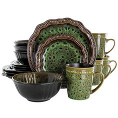 a green and black dinnerware set with matching cups