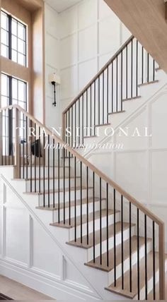 a white staircase with wooden handrails in a home