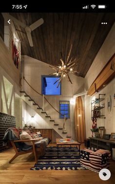 a living room filled with furniture and a ceiling fan