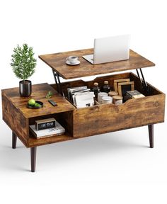 a coffee table with an open drawer underneath it and a laptop computer on the top