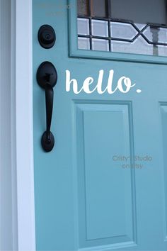 a blue front door with two black handles