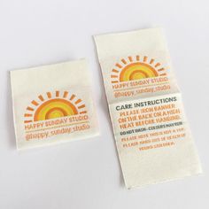 two patches with the words happy sunday studio and care instructions printed on them, sitting next to each other