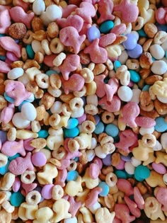 there is a large amount of cereal with different colors and shapes in the bowl on the table