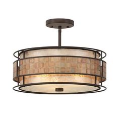 a semi - flush ceiling light fixture with a brown and beige shade on the drum