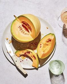 a white plate topped with cut up melons