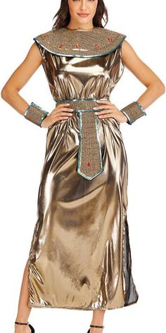 a woman in a gold dress with an egyptian headpiece on her neck and arm