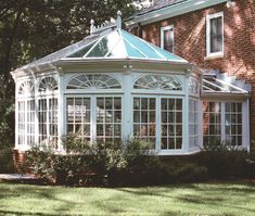 a house with a glass roof in front of it