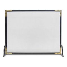 a black and white fireplace screen with gold trimmings on the sides, against a white background