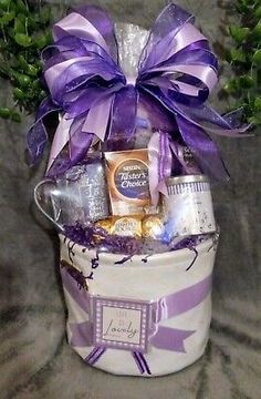 a gift basket filled with chocolates, candy and candies for someone's special occasion