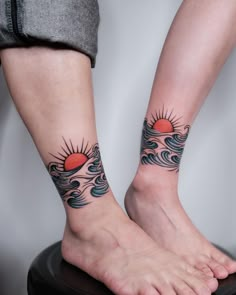 two people with matching tattoos on their feet