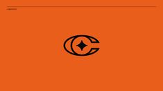 an orange background with the letter c in it's center and a black star on top