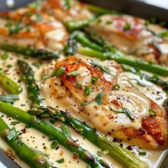 asparagus, chicken and cheese dish in a pan