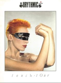 a woman with red hair and blindfolded face is shown in a white frame