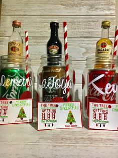 three bottles of coca - cola are sitting next to each other on a table with christmas cards