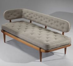 an old style couch with no cushions on it