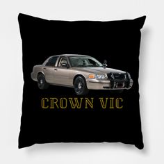 a black pillow with an image of a brown car and the words crown vicc on it