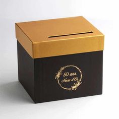 a black and gold box with a wreath on the lid that says 50 and i need a hug