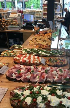 many different types of food on display in a store