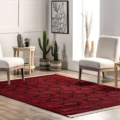 a living room with two chairs and a rug