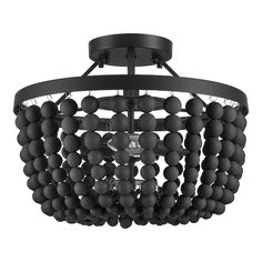 a black chandelier with balls hanging from the ceiling