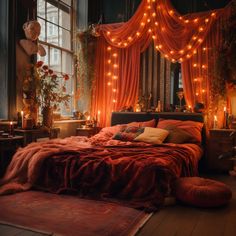 a bed in a room with lights on the ceiling and curtains hanging over it's headboard