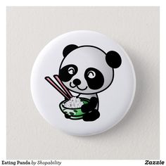 a button with a panda eating rice and chopsticks in its mouth, on a white background